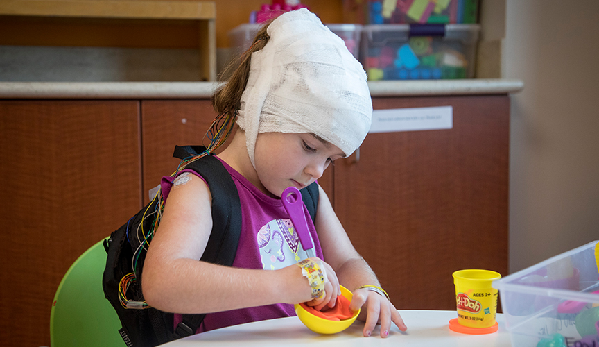 A Le Bonheur patient plays in the epilepsy monitoring unit playroom.